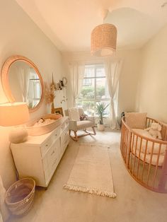 a baby's room with a crib, rocking chair and dresser in it