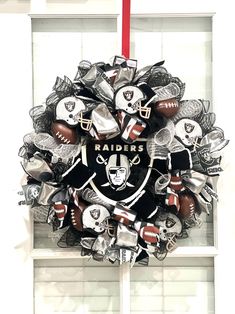 a wreath with footballs and helmets on it