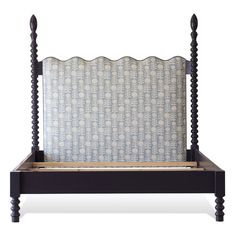 a black bed frame with an upholstered headboard and foot board