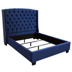 an upholstered blue bed frame with buttons