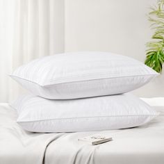 two white pillows stacked on top of each other