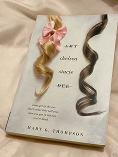 a book with two different colored hair on it