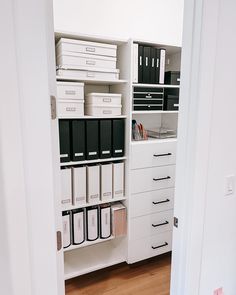 an organized closet with drawers and file cabinets