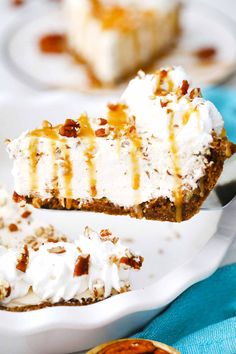 a piece of cheesecake on a white plate with a fork in the foreground