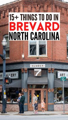 people standing on the sidewalk in front of a building with a sign that says 15 things to do in brevard, north carolina