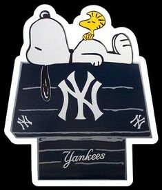 a sticker depicting the new york yankees and snoopy on top of a baseball field