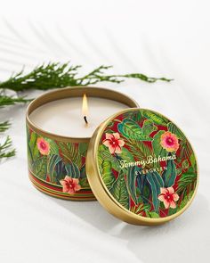 a candle that is inside of a tin