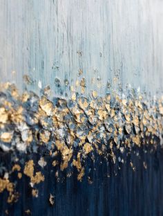 an abstract painting with gold and blue colors on it's surface, including the paint