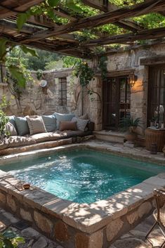 an outdoor hot tub in the middle of a patio