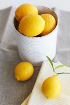 the color scheme is yellow and gray, with some lemons in a white bowl