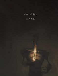 the elder wandd movie poster with an image of a person holding a light in his hand