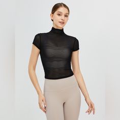 Features: Basic Style Sheer: Sheer Stretch: Highly Stretchy Material Composition: 85% Polyamide, 15% Spandex Care Instructions: Machine Wash Cold. Tumble Dry Low. Imported Product Measurements: S:Bust 28.35 In, Sleeve Length 4.33 In, Top Length 19.29 In M:Bust 29.92 In, Sleeve Length 4.65 In, Top Length 20.08 In L:Bust 31.50 In, Sleeve Length 4.96 In, Top Length 20.87 In Xl:Bust 33.07 In, Sleeve Length 5.28 In, Top Length 21.65 In Stretch Mesh Tops With Short Sleeves, Fitted Mesh Yoga Tops, Fitted Mesh Top For Athleisure, Trendy Fitted Moisture-wicking Top, Stretch Mesh Top With Crew Neck, Mesh Short Sleeve Workout Tops, Fitted Mesh Workout Top, Fitted Mesh Top For Workout, Trendy Fitted Gym Tops