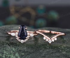 two engagement rings with diamonds on top of each other, one is black and the other is white