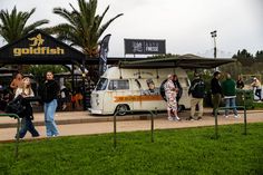 people standing in front of a food truck