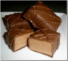 several pieces of chocolate on a white plate