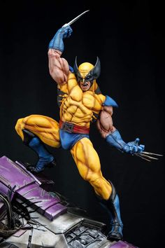 a statue of wolverine is posed on top of a purple car with his claws out