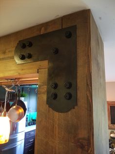 a wooden wall with some lights hanging from it