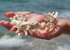 This elegant piece made with seashell, starfish, pearls, flowers and crystals. These kinds of hairbands are loose enough not to give headaches (for those sensitive to that) but still stay in place! This headband is perfect for bride, bridesmaid, and flower girl. Shipping: -Tracking number -Your item will be carefully packaged and shipped with love Custom order always welcome, please contact us Thanks for looking! https://www.etsy.com/shop/CyShellBridal Beach hair accessory, Beach tiara, Sea shel Seashell Headpiece, Seashell Tiara, Seashell Headband, Beach Wedding Hair Accessories, Beach Hair Accessories, Bridesmaid Crown, Flower Girl Tiara, Cowrie Shell Jewelry, Girls Tiara