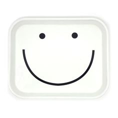 a white plate with a smiley face drawn on it