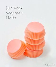 four orange cups sitting next to each other on top of a white surface with the words diy wax warmer melts