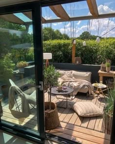 an outdoor living area with furniture and plants