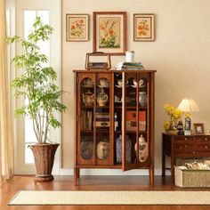 a living room filled with furniture and a potted plant