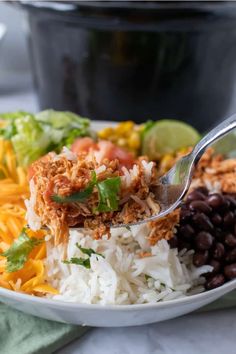 a white bowl filled with rice and beans