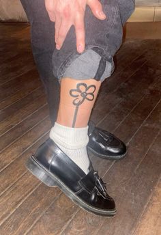 a person with a tattoo on their leg