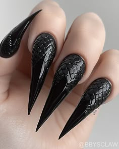 ✨ Dive into the shadows with our latest dark-themed nail polish designs—where creativity meets mystery. Each bottle holds a unique story, waiting to dance on your fingertips. Unleash your inner artist and embrace the allure of the unknown. 🖤💅 #DarkNails #ArtInBeauty Gothic Biab Nails, Assassin Nails, Pointy Gel Nails, Dark Fantasy Nails, Maleficent Nails Designs, Succubus Nails, Dark Coffin Nail Ideas, Black And Silver Stiletto Nails, Long Stiletto Nails Design Classy