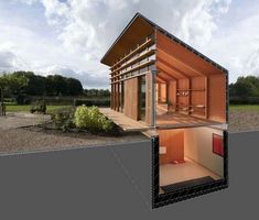 an image of a house made out of wood and glass in the middle of a field