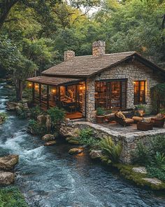 a small cabin with a river running through it