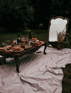 a table that has food on it in front of a mirror