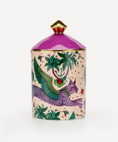 a pink and gold canister with an image of a bird on it