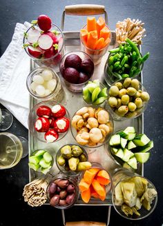 an assortment of fruits and vegetables on a tray