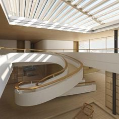 the interior of a building with a spiral staircase and skylight above it is shown