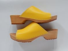 The clogs are availble in purple, yellow, turquiose (as on the piuctures) and black, deep brown, red, sand/light beige and white. Our handmade wooden clogs are made in a traditional European shoemaker workshop. ~made of finest european poplar wood and natural leather ~anatomicall footbed with arch support ~adjustable fasten on the ankle ~wooden sole covered with a thin rubber Our beautiful clogs are: ~perfect for every woman ~stylish and useful for casual wear ~perfect solution for looking both Summer Women Shoes, Clogs Women, High Heel Clogs, Red Sand, Moccasins Women, Swedish Clogs, Clogs And Mules, Handmade Leather Shoes, Wooden Clogs