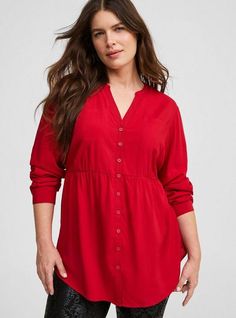 FIT Model is 5'9” wearing size 1. Measures 34” from shoulder (size 2). Babydoll silhouette. MATERIALS + CARE Challis woven fabric: New, improved, and loved by all—and still lightweight, drapey, and (really! ) machine-washable. . Stretch level: None. . 72% rayon, 28% polyester. Machine wash cold. Tumble dry low. Imported. DETAILS Split neckline. Button up. Chest pockets. Long sleeves. The best plus size women's emma babydoll challis tunic the in jester red made of washchallis. Torrid is your destination for cozy fall and winter clothes to keep you warm and comfortable. Cheap Red Casual Peasant Top, Casual Red Short Sleeve Tunic, Casual Red Long Sleeve Tunic, Red Bohemian Printed Tunic, Red Tunic Top, Red Tunic, New Street Style, Bra And Panty Sets, Sweaters Online