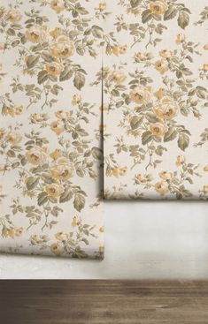 two pieces of wall paper with yellow flowers on them, one is folded up and the other half closed