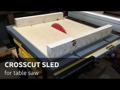 a table saw with a piece of wood cut into it and the words crosscut sled for table saw