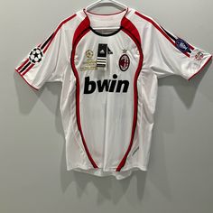 a soccer jersey hanging up on a wall