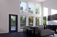 a living room filled with lots of windows next to a tv mounted on a wall