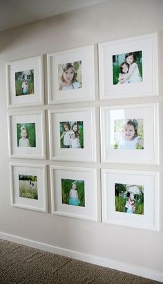 a white wall with many pictures hanging on it's sides and the bottom half is filled with photos