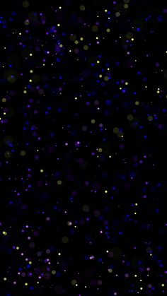 a black background with lots of purple and yellow dots