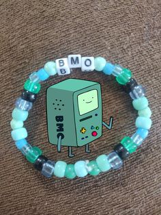 a beaded bracelet with an image of a cartoon character on it and the words bmo