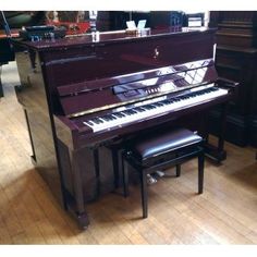 a piano and stool in a room