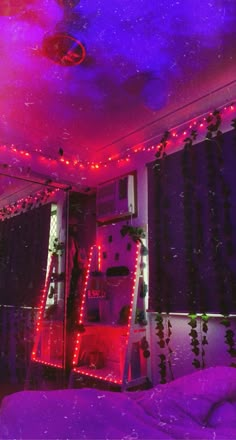 a bedroom with purple lights and curtains on the ceiling