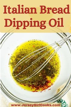 the ingredients for italian bread dipping oil in a glass bowl