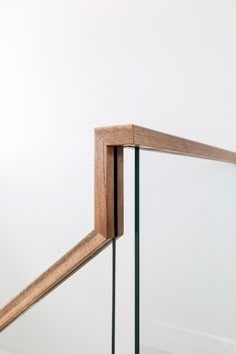 an image of a wooden railing with glass balconies on the top and bottom