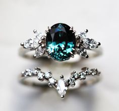 a ring with a blue diamond surrounded by white diamonds