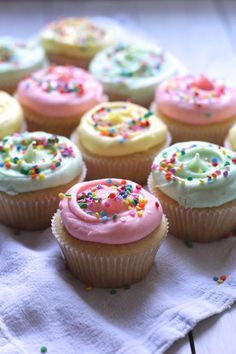 cupcakes with frosting and sprinkles on a napkin